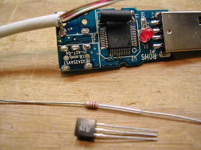 Prepare one end of the 5 conductor cable by separating the shield, twisting it tightly, then soldering it to the ground on the board below as shown.