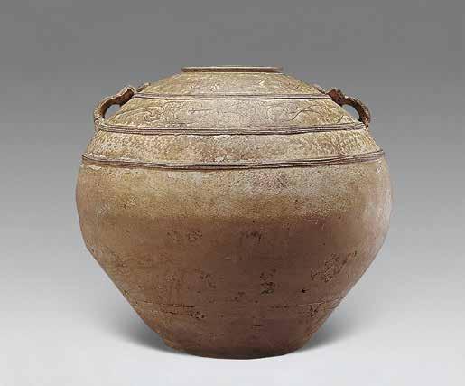 Primitive Celadon Double-handle Jar Origin: Han Dynasty Height: 33 cm Appraisal: RMB 28,000 Name of Auction Company: China Guardian Date of Transaction: 2006-11-22 This jar has an inward-sloping