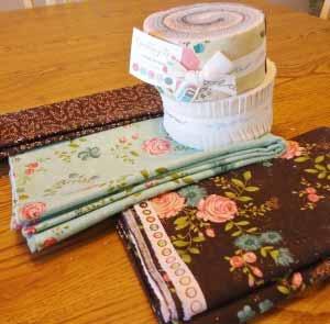 1 Rambling Rose Jelly Roll 1 Bella Solid Jelly Roll in Natural 2 yards of Teal Rain for the setting squares 2 ¼ yards Chocolate for the outer border 1