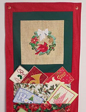 Christmas Keepsake Wall Hanging This classic Christmas wall hanging was inspired by stitcher Diane's fabulous Christmas card holders that were featured in the Stitchers Showcase.