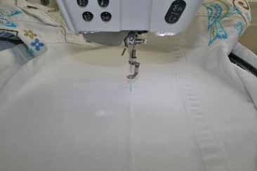 Embroider the Jacket Sleeve Using a seam ripper, open the sleeve and side seam of the jacket to aid in flattening the sleeve for embroidery.