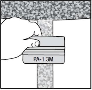 Figure 6 8. Fold over either side of the unapplied film and peel back the liner approximately 30 cm, allowing the liner to keep the adhesive off the floor (Figure 7). Figure 7 9.