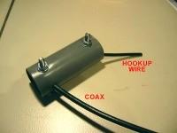 Now gently retract the coax in the tube, while inserting the hookup wire till it comes out of