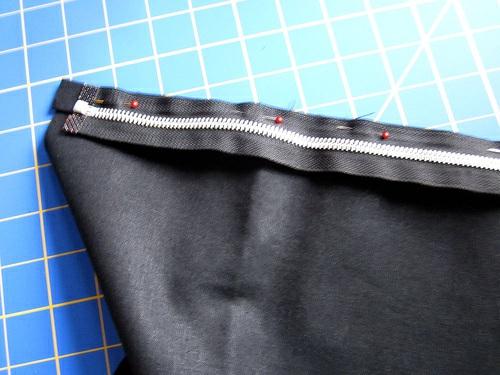 zipper and the wide fabric panel. Center the zipper/strip top to bottom on the panel.