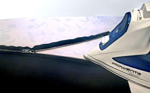 Flip the zipper to the right side and press the fabric away from the zipper teeth. 8.