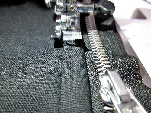 9. Repeat to attach the remaining folded strip and narrow back panel to the opposite side of the zipper. Decorative stitching 1.