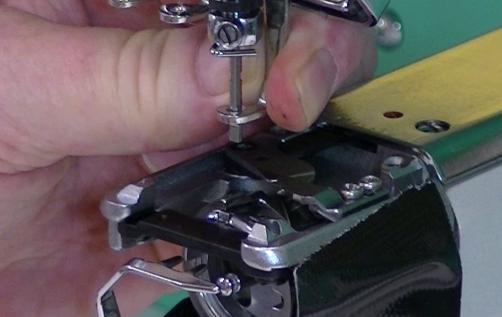 If the presser foot has been bent from striking a hoop or other object, The RhAT tool may be deflected when making the adjustment.