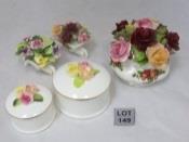 00 149 A collection of ceramic floral (mostly roses) ornaments including a Royal Albert