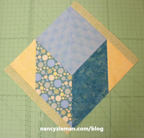 Add 2 yellow square at center. Arrange four blocks to create Lone Star Makeover. Stitch.
