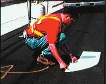 4) Position the preformed thermoplastic on the pavement surface. Position all connecting parts of the marking on the road with the exposed beaded side up.