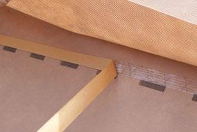 The tape can be pressed onto each rafter and it will naturally stick between the rafters.
