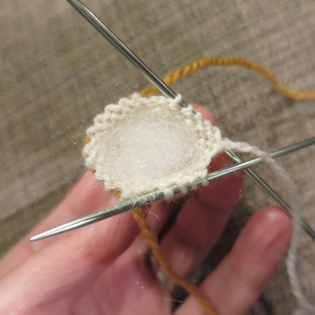 GIRL Head and body: Cast on 6 stitches. Divide between three needles and join together to knit in the round. Place a marker between the first and last stitch to mark rows.