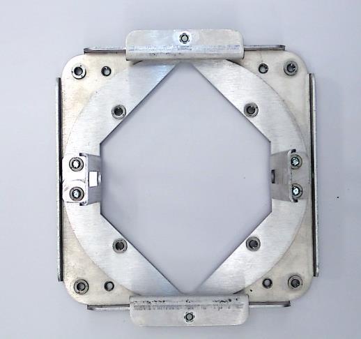 5) Slide circular plate into mounting assembly. 6) Secure circular plate into mounting assembly using Mounting Tabs (C) and Mounting Screws (D).