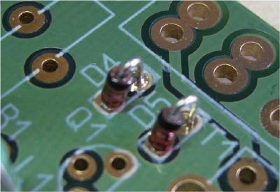 D3 is similar to the N448 ones but thicker, and it is marked as BZX85C47. DV is a BB varicap diode and is similar to a transistor with only two legs; its outline should fit the silkscreen of the PCB.