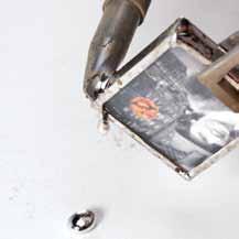 Once your iron is heated to the right temperature, pick up a bead of solder with your iron tip.