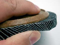 A large number of perpendicular grinding flaps (approximately twice as many as on conventional flap discs) with small gaps between them make it possible to combine different