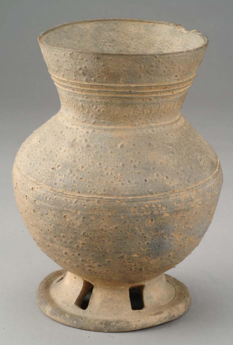 Tall Ceremonial Stand for jar mid 5 th to mid 6 th century unglazed stoneware with cutout decoration UMMA 2004/1.