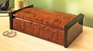 For starters, it has a broad contoured lid and matching front and back panels, which show off the beauty of the wood.