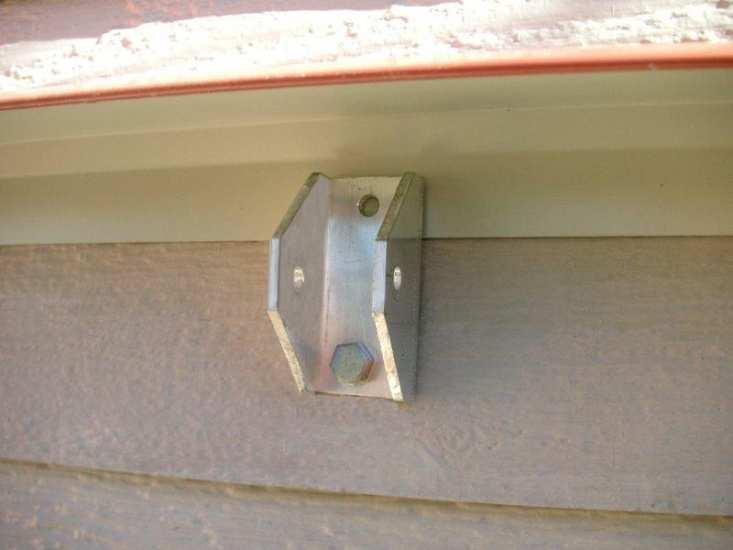 using the provided 1/4 x 3-1/2 lag screws or other fasteners appropriate for your siding and wall