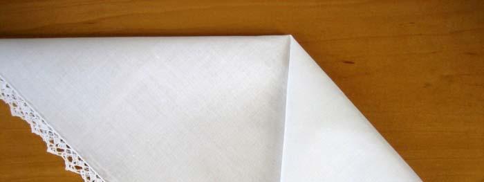 2. Fold the handkerchief diagonally in half and press the fold with an iron 3.