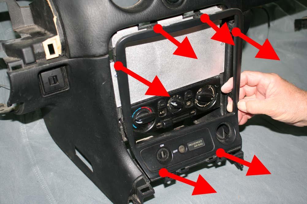 3. Remove radio bezel by grabbing it from the bottom, then pulling it evenly towards the shifter.
