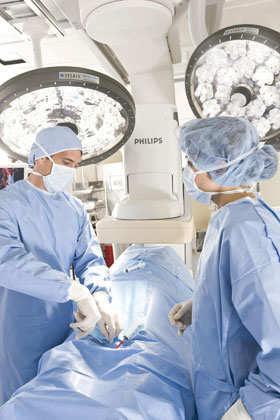 In a cardiovascular operating room, LED lights are integrated into a surgical lighting system. Photo courtesy of STERIS.