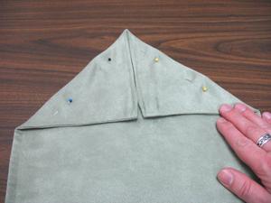 To create the triangular ends, lay the runner flat with the bottom