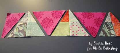 For the long sides of the quilt you will need to join 14 pieced triangles and 13 amethyst triangles.