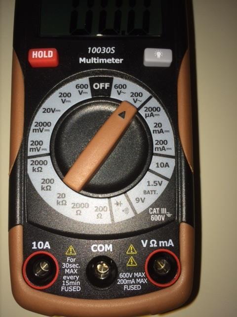 5. Using the Voltmeter set to measure AC voltage, touch the leads across the audio cable coming from the AVR (one lead touching the center signal pin, and the second lead touching the outer grounding