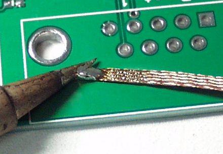 Once the PCB has cooled down, use a magnifying glass to inspect your work.