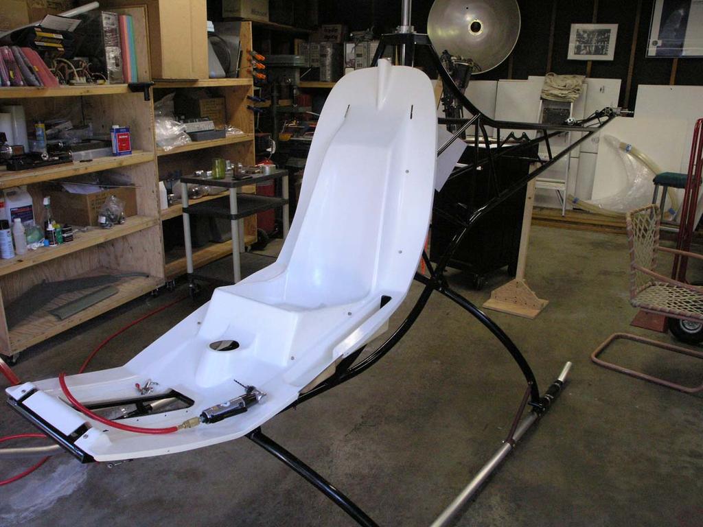 The seat pan is now installed in the frame. I still have much work to do here: 1) Cut two access holes on the front side of the seat, behind each thigh.