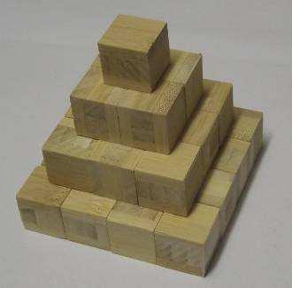 Using wooden cubes we can approximate the shape of a pyramid as shown below. Clearly the greater the number of layers the better the approximation is to a pyramid.