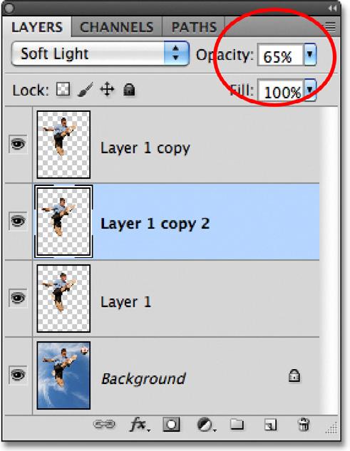a moment ago. Holding the Alt (Win) / Option (Mac) key down tells Photoshop to make a copy of the layer as you drag with the Move Tool, which gives us another copy of our subject.