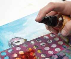16 Use orange spray ink and a stencil to add stenciled