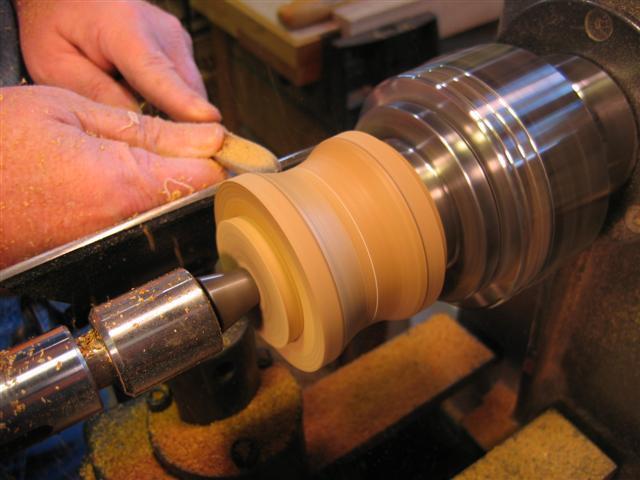 With the lid jammed onto the box body use a spindle gouge to refine the shape.