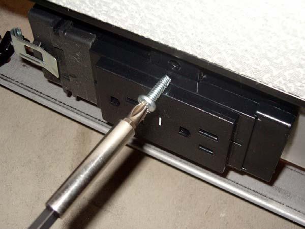 Using screws provided for Outlets, screw outlet to powerway as shown.