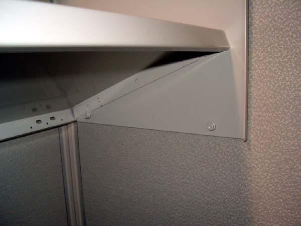 Hold shelf pan between shelf ends and lower over nuts on shelf end.