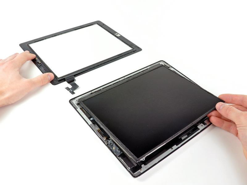 Lift the LCD from its long edge farthest from the digitizer cable and gently flip it toward the rear case like closing a book.