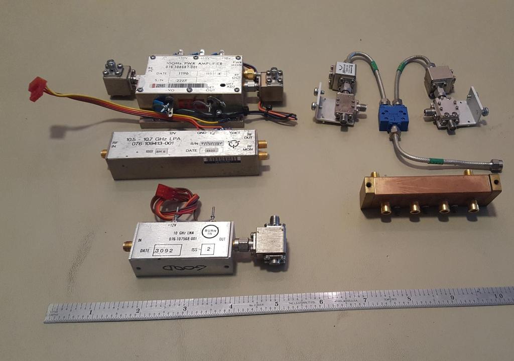 Various 10 GHz surplus items that could be used to build a transverter Harris 10 GHz 3W PWR AMP 076-108687-001 Harris Isolators.