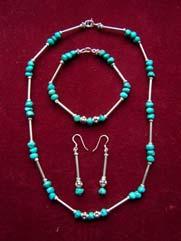 Sterling silver and turquoise Artist: Debra Munson Medium: Silver and turquoise jewelry Price: $60.00 Autumn road Artist: Jane Sheaffer Medium: Photograph Size: 13 (W) x 17 (H) Price: $100.
