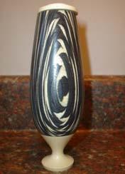 Turned vessel (two-toned) Artist: Jack Wohlstadter Medium: Vessel - two toned pressed wood Lid and base - turned Holly Size: 5 inches tall Price: $200.00 Individuals of all ages struggle.