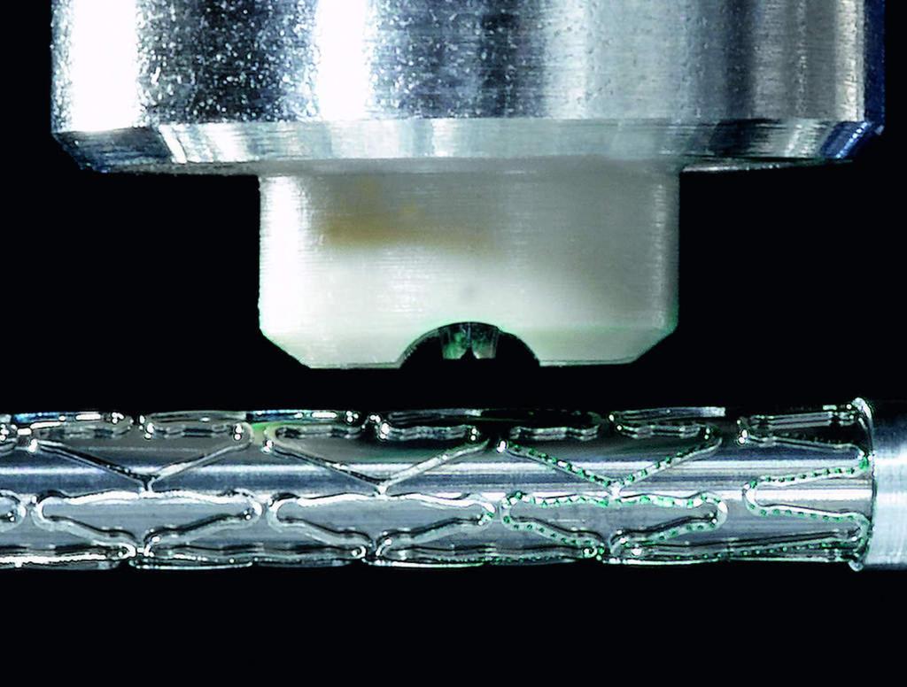 Seite/Page: 8 Figure 5: Stent coating in progress showing inkjet dispenser and rotating mandrel (left) with a close-up view in which the inkjet