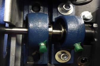 Install motor chain and assembly With the chain loosely around both large and small gears, lift
