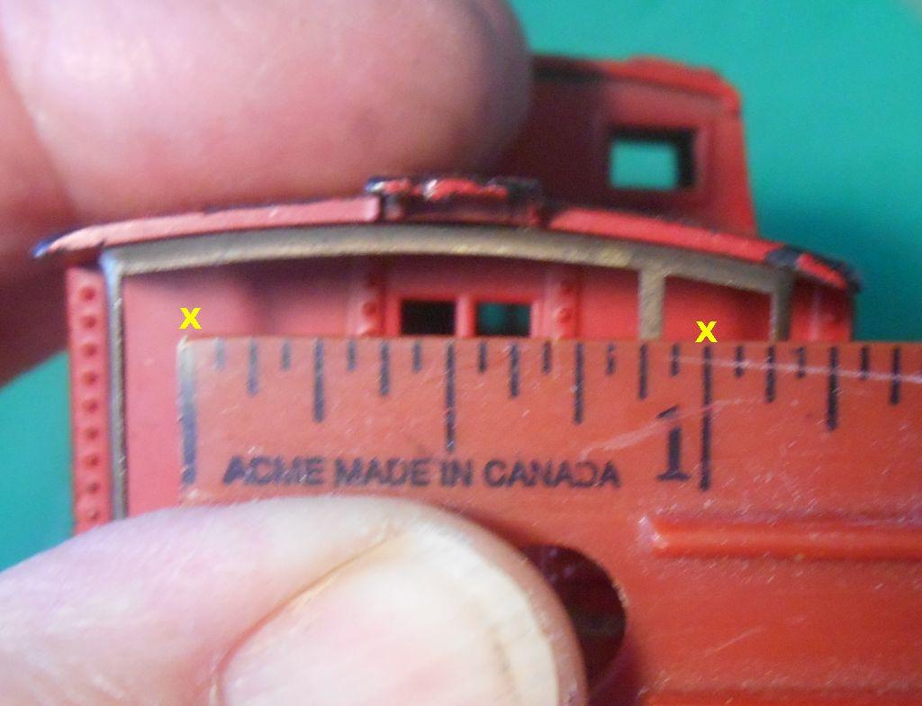 positions when in the hole. Step 3. Drill Holes in the rear wall. Two holes are drilled in the rear wall of the caboose.