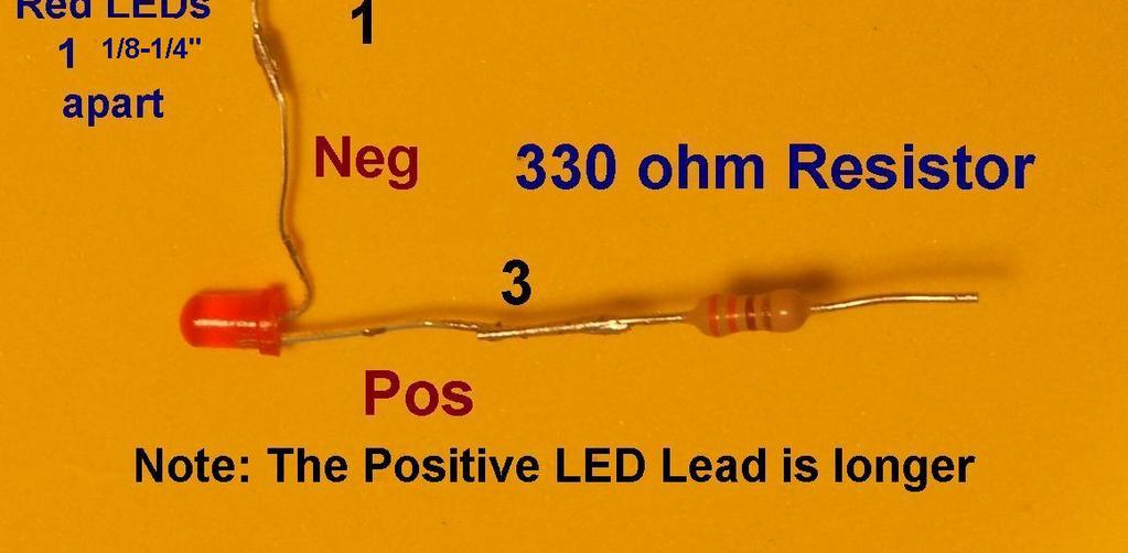 Positive lead of the red LED.