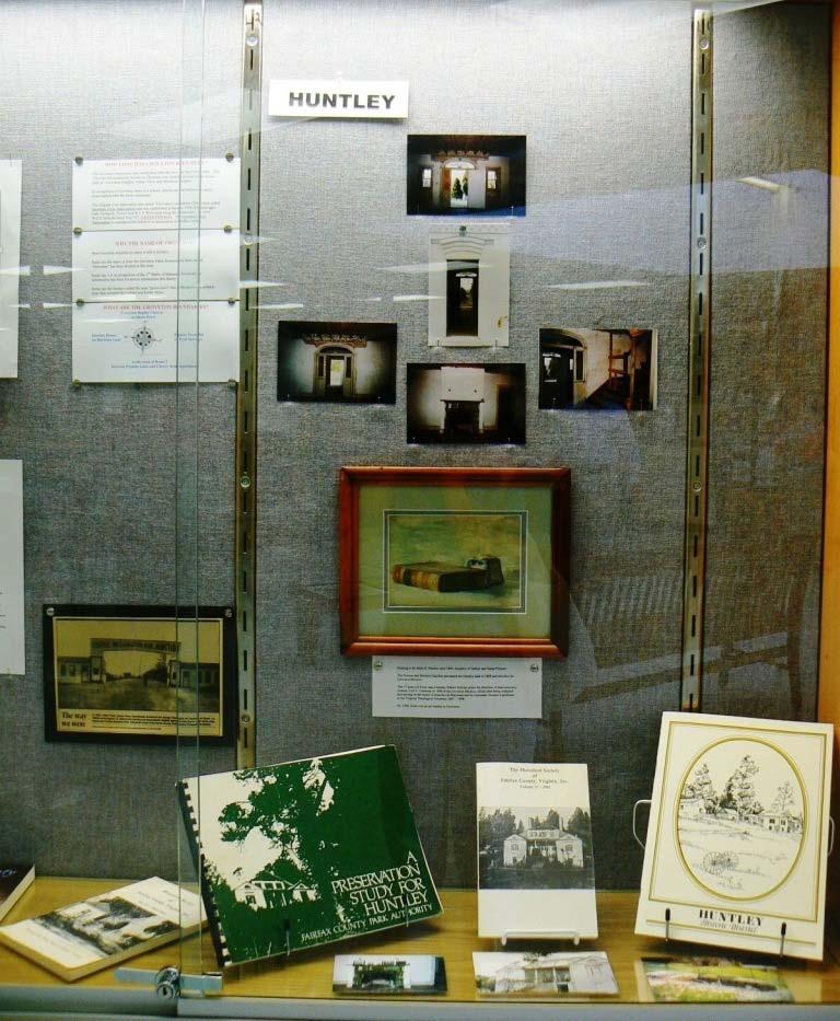 The Huntley portion of the display case contained a variety of books about Huntley House, pictures of the interior of the Huntley House and