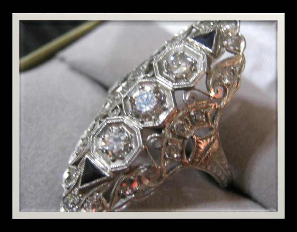 A gorgeous Art Deco diamond and sapphire ring with a lacey platinum