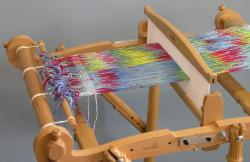 Start weaving with some scrap yarn, anything that s about the same weight will do.