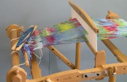 Four to five passes of yarn should spread the warp threads and let you know if there is a mistake that needs correcting.