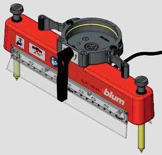 a Machine accessories 9 spindle head 9 spindle head for use with MINIPRESS/MINIDRILL Bores nine holes spaced 32 mm apart, parallel to the fence Once aligned the spindle head is always parallel to the